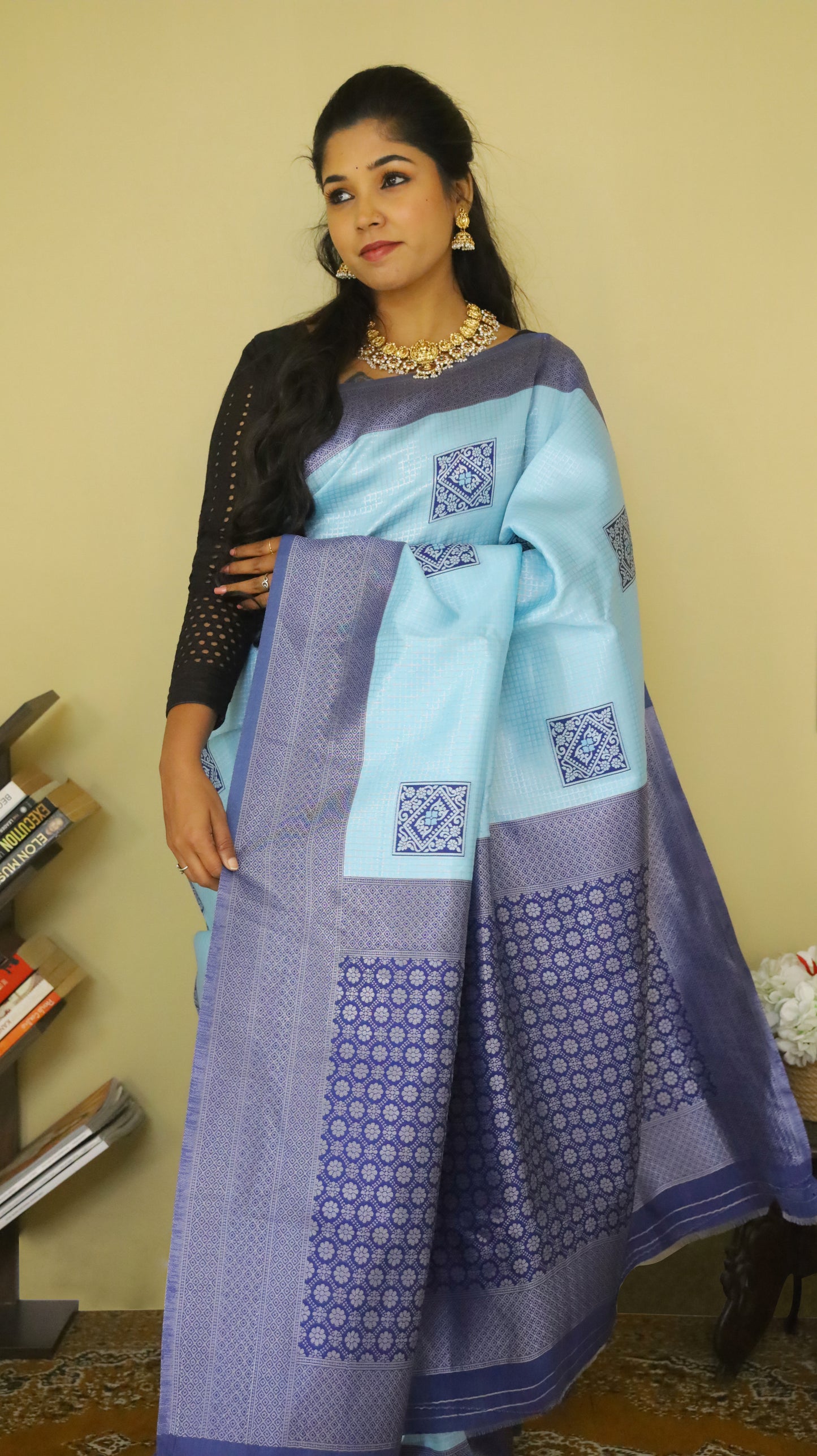 Graceful Soft Silk Saree with a soft light blue body, adorned with delicate buttas, and complemented by a bold dark blue border and pallu - AVANTHIKA