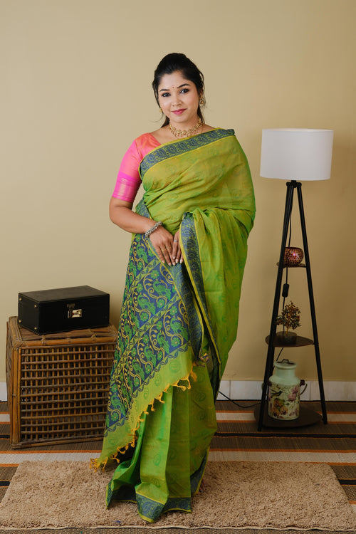 Handloom cotton in parrot green double shot with blue leaf border - BOOMIKA