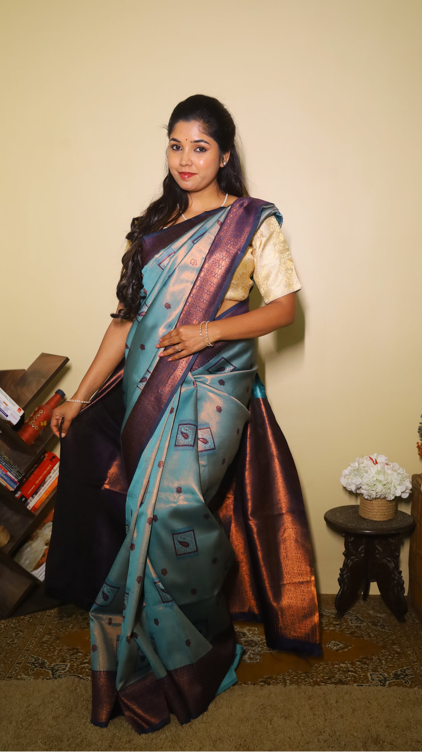 Classic soft silk tissue saree in light aqua blue body with rust-colored motifs and turquoise border along with copper-gold zari - AVANTHIKA