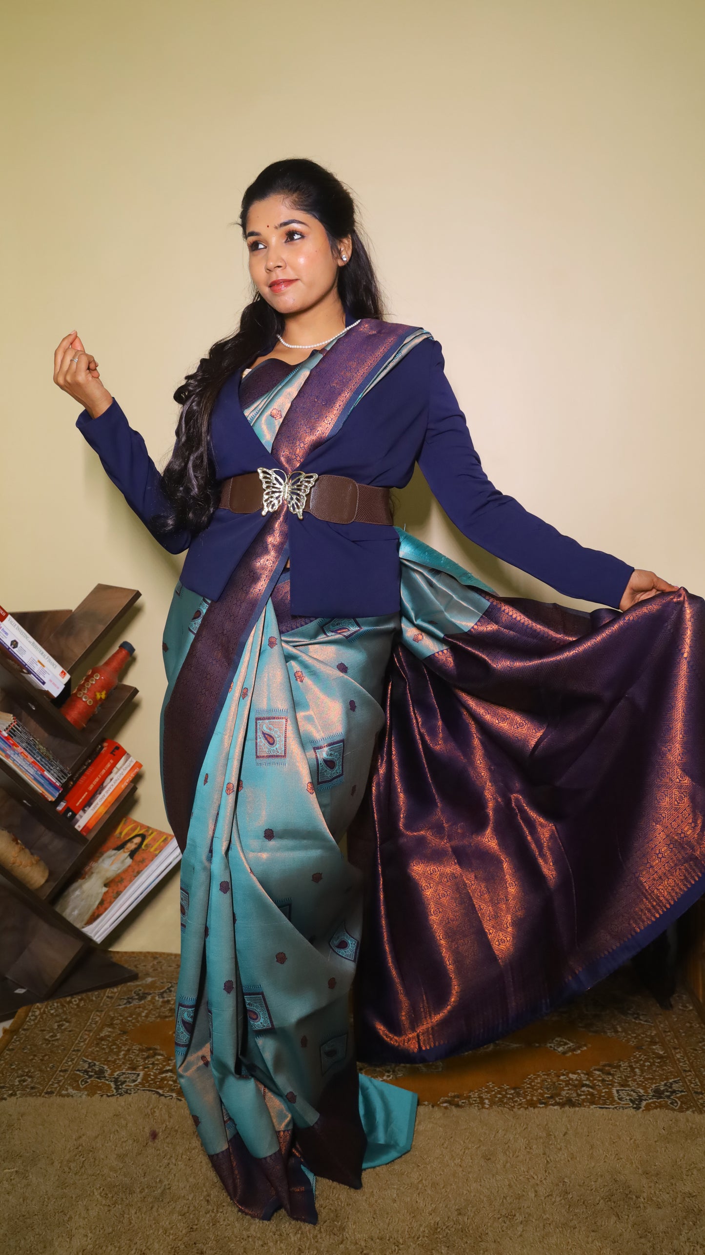 Classic soft silk tissue saree in light aqua blue body with rust-colored motifs and turquoise border along with copper-gold zari - AVANTHIKA