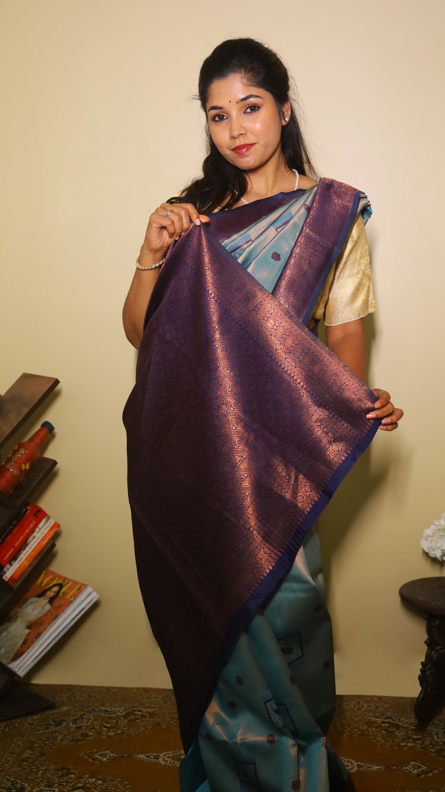 Classic soft silk tissue saree in light aqua blue body with rust-colored motifs and turquoise border along with copper-gold zari - AVANTHIKA