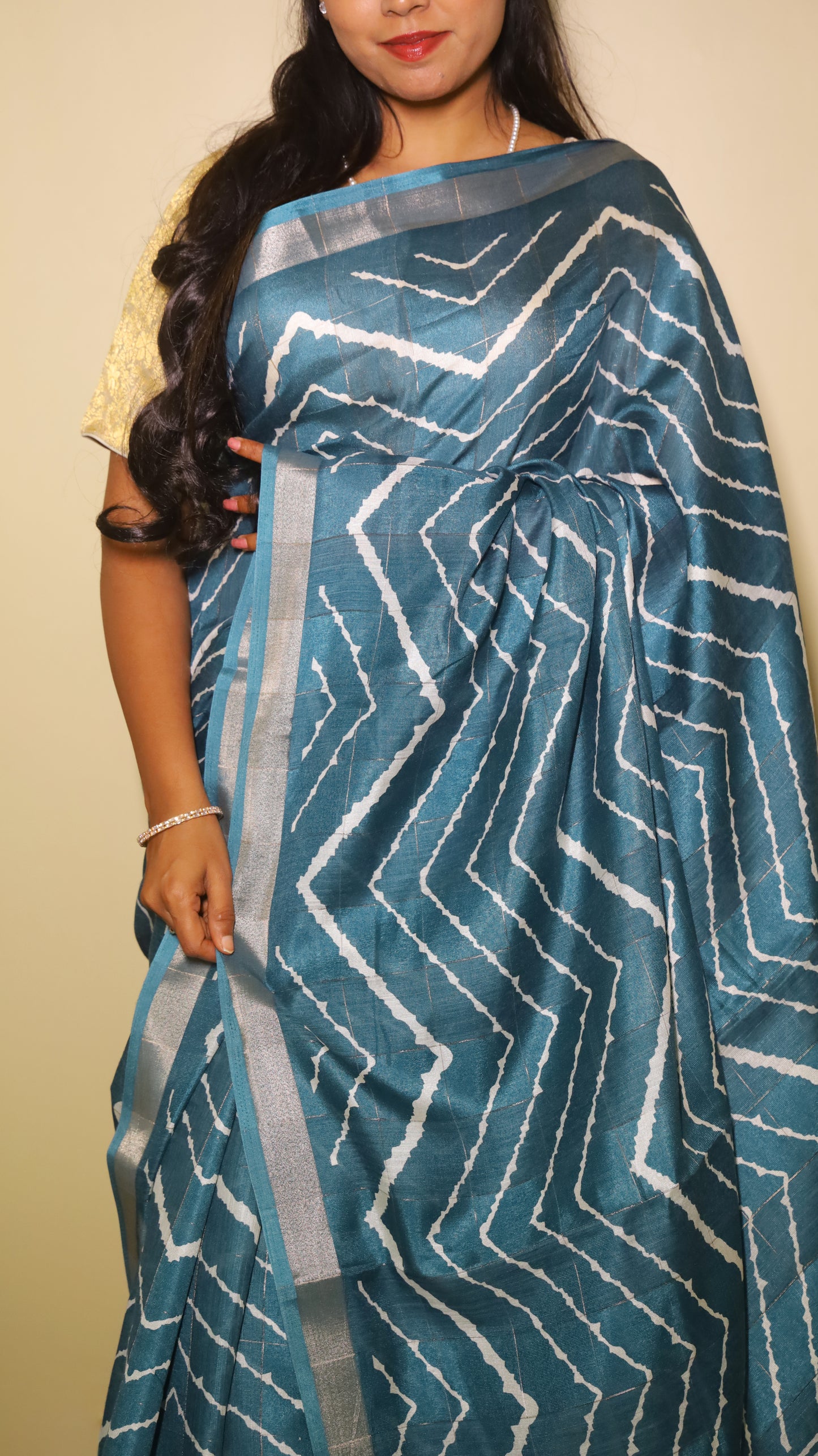 Elegant teal Chanderi Silk Cotton saree designed with bold silver chevron patterns running across the body - VEDHIKA