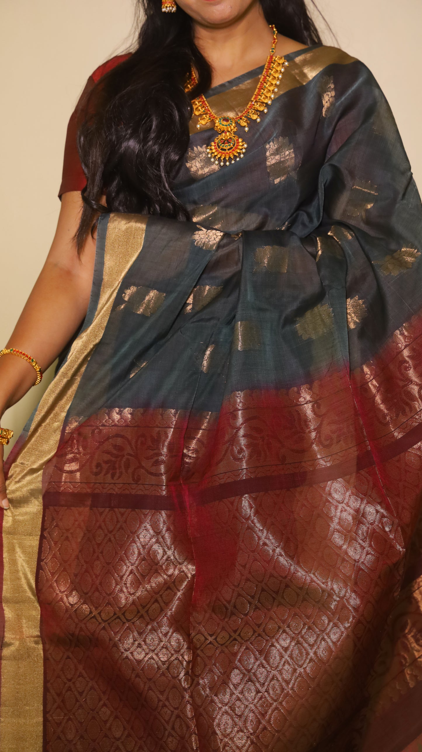 Exquisite silk cotton saree in bottle green and reddish maroon, handwoven with intricate designs - SWASTHIKA