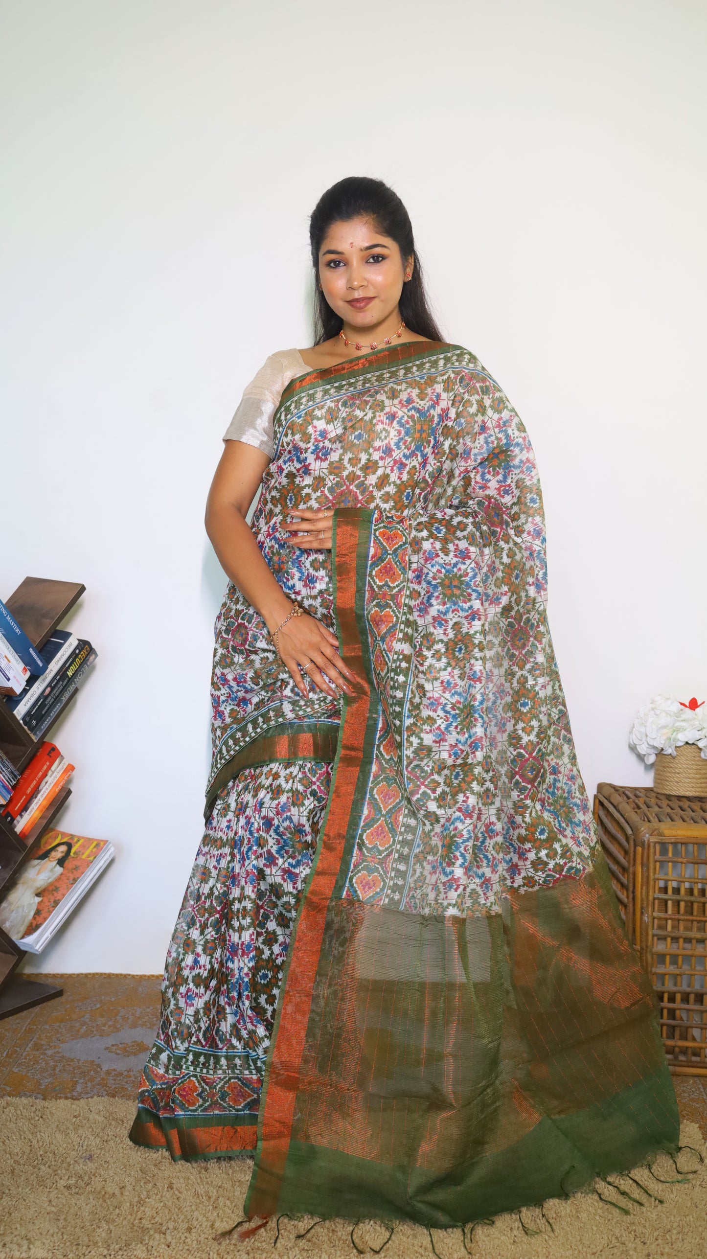 Graceful Semi Silk Cotton Saree in white and adorned with exquisite Patola prints - VEDHIKA