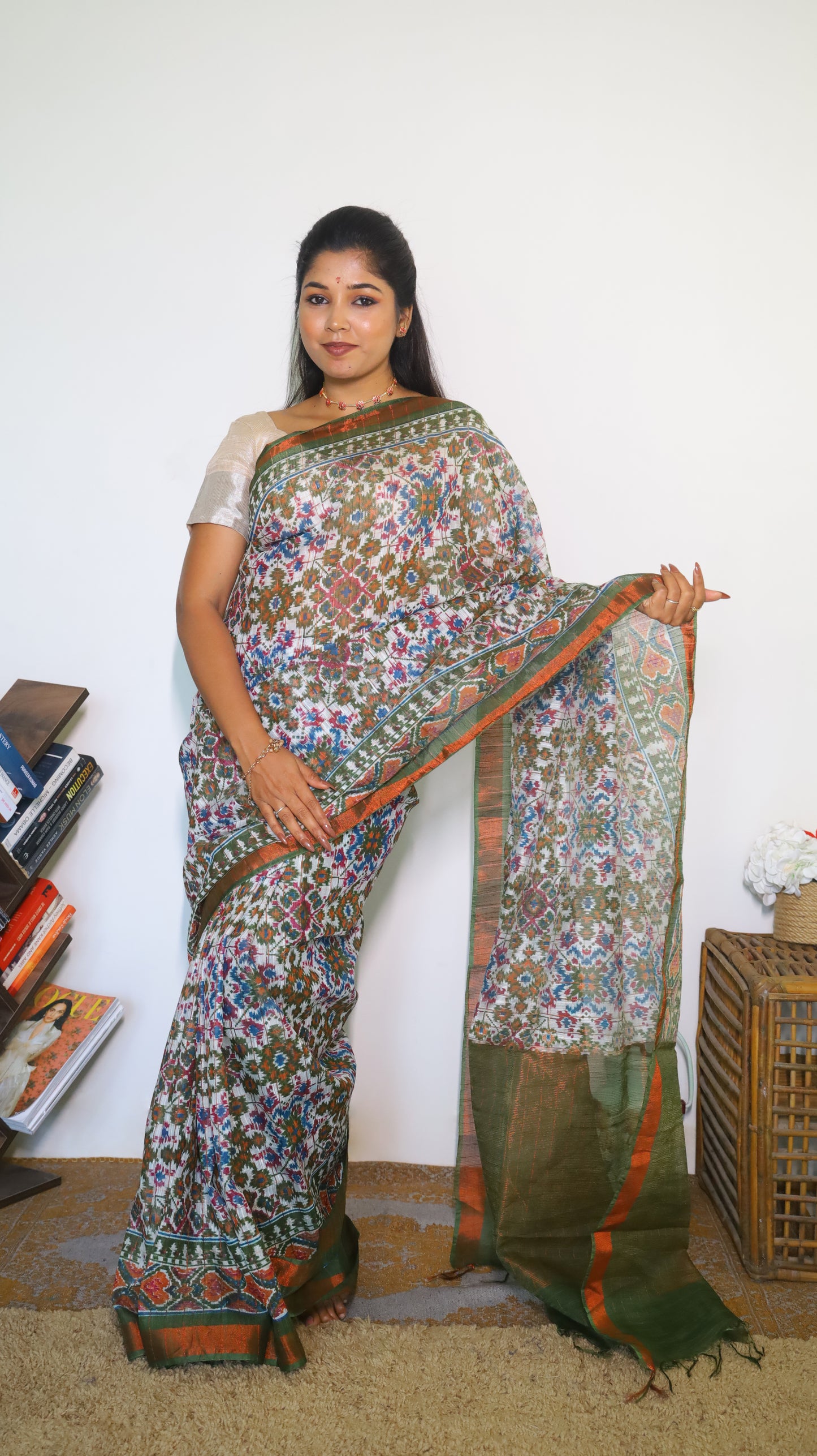Graceful Semi Silk Cotton Saree in white and adorned with exquisite Patola prints - VEDHIKA