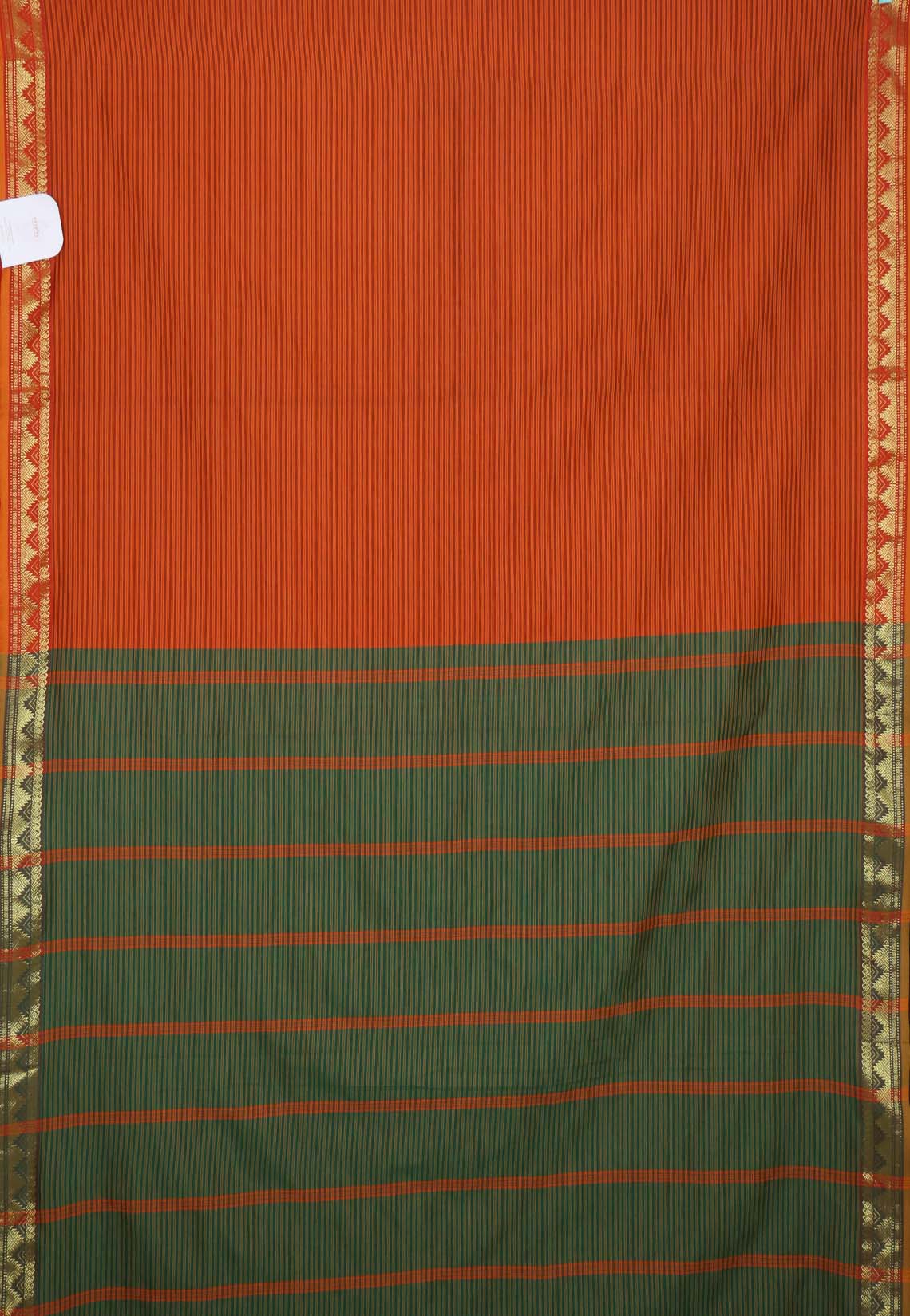 Striking rust-orange saree with fine black pinstripes and a contrasting green pallu with textured zari border and playful tassels- VARSHIKA