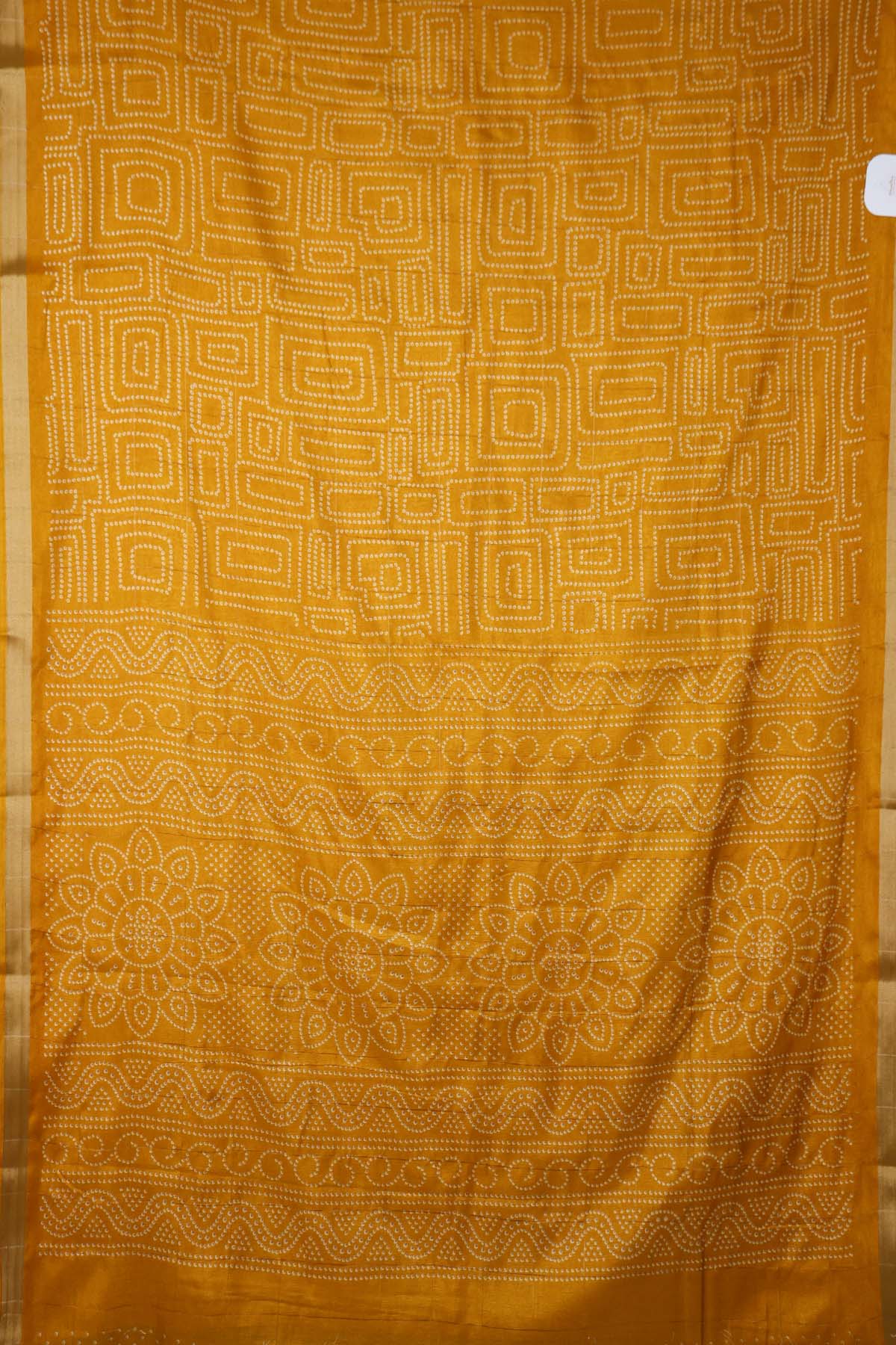 Turmeric gold semi silk saree with its intricate white dotted body, perfect for casual wear - SHRUTHIKA
